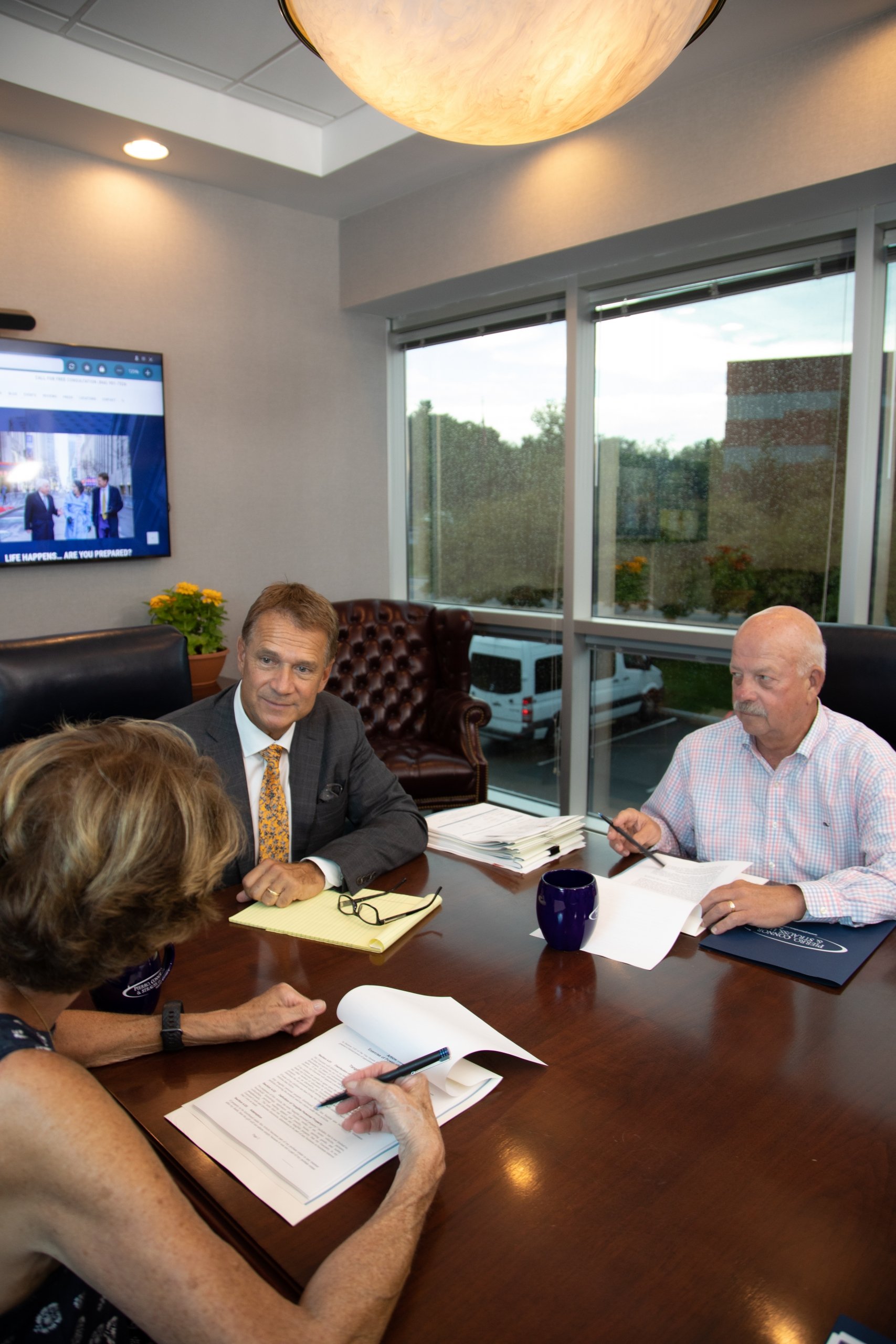 Albany Estate Planning attorneys collaborate in their home office with a client