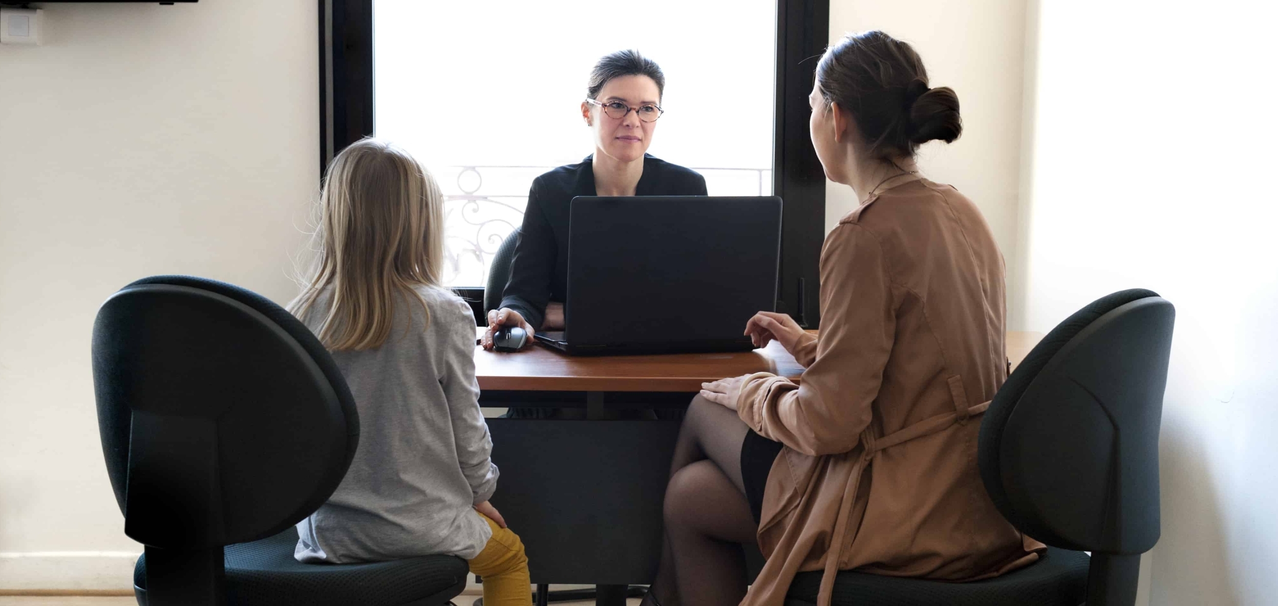 parent teacher meeting with child to discuss the child's IEP