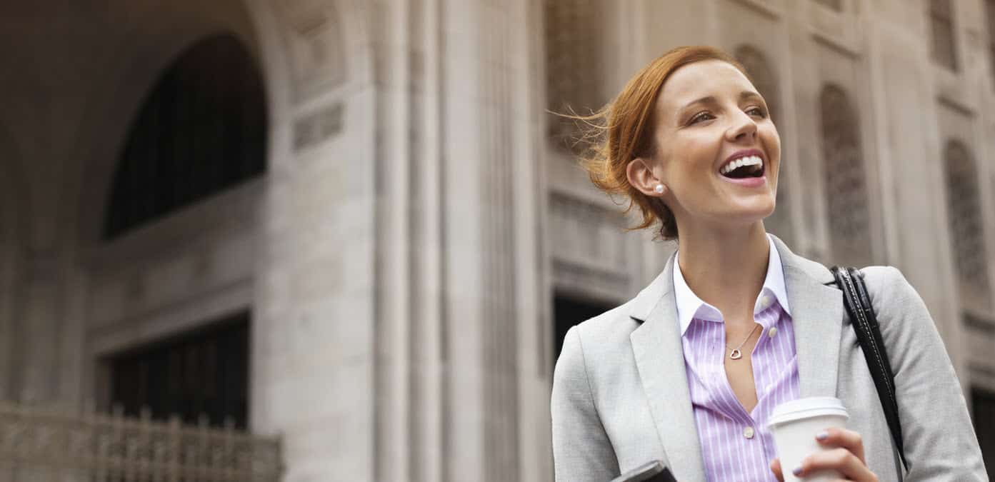 Businesswoman smiling on city street Businesswoman smiling on city street