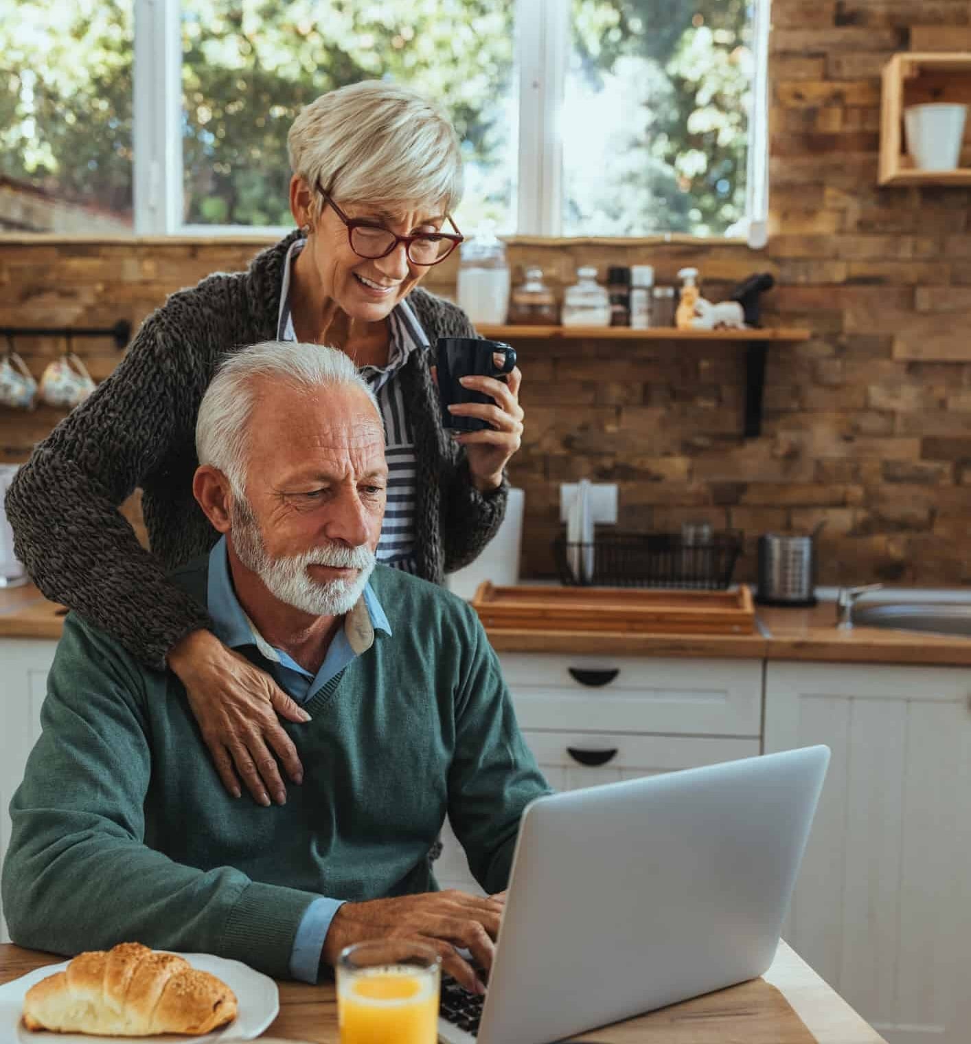 HNW couple on laptop HNW couple on laptop