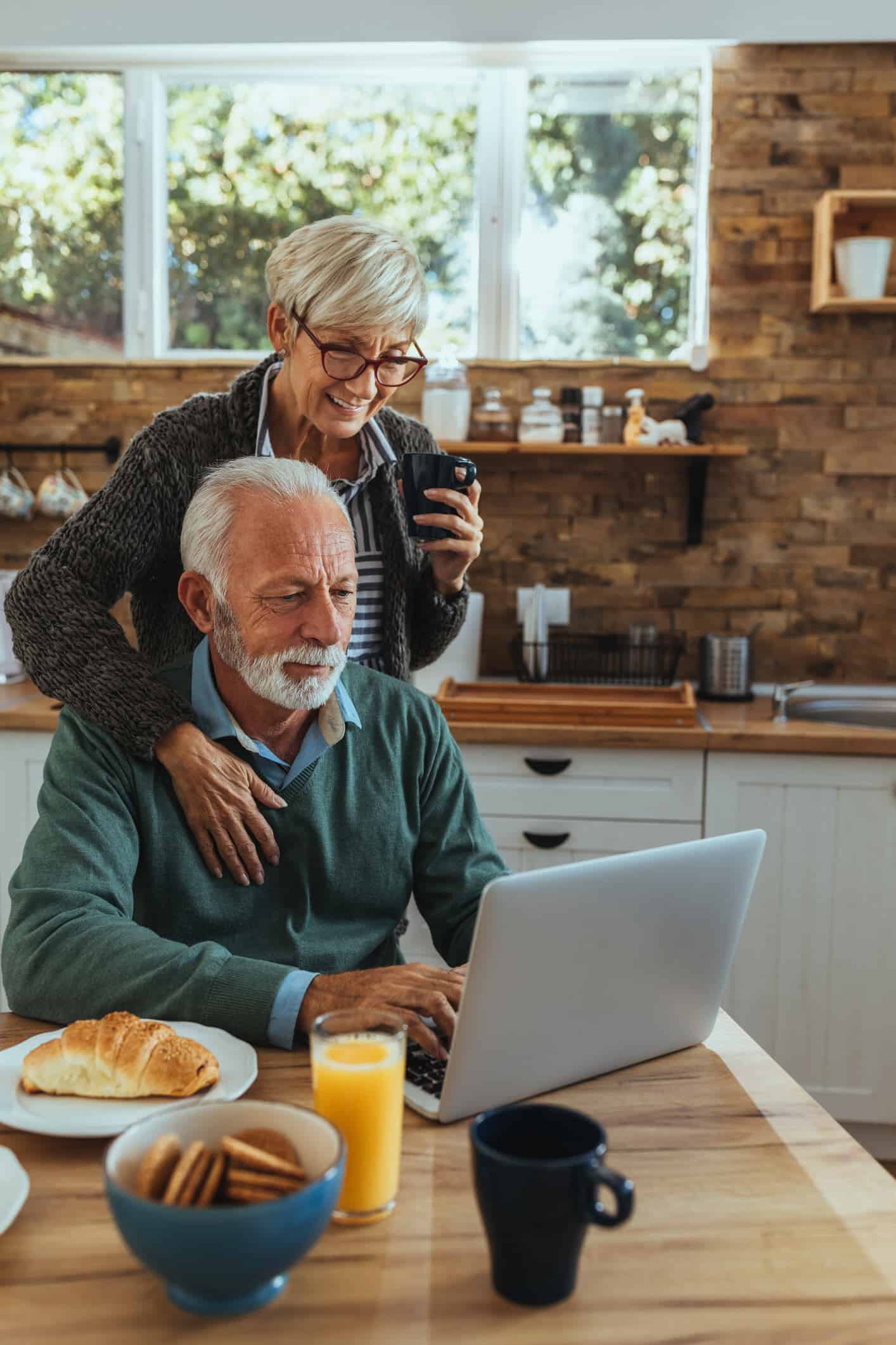 HNW couple on laptop