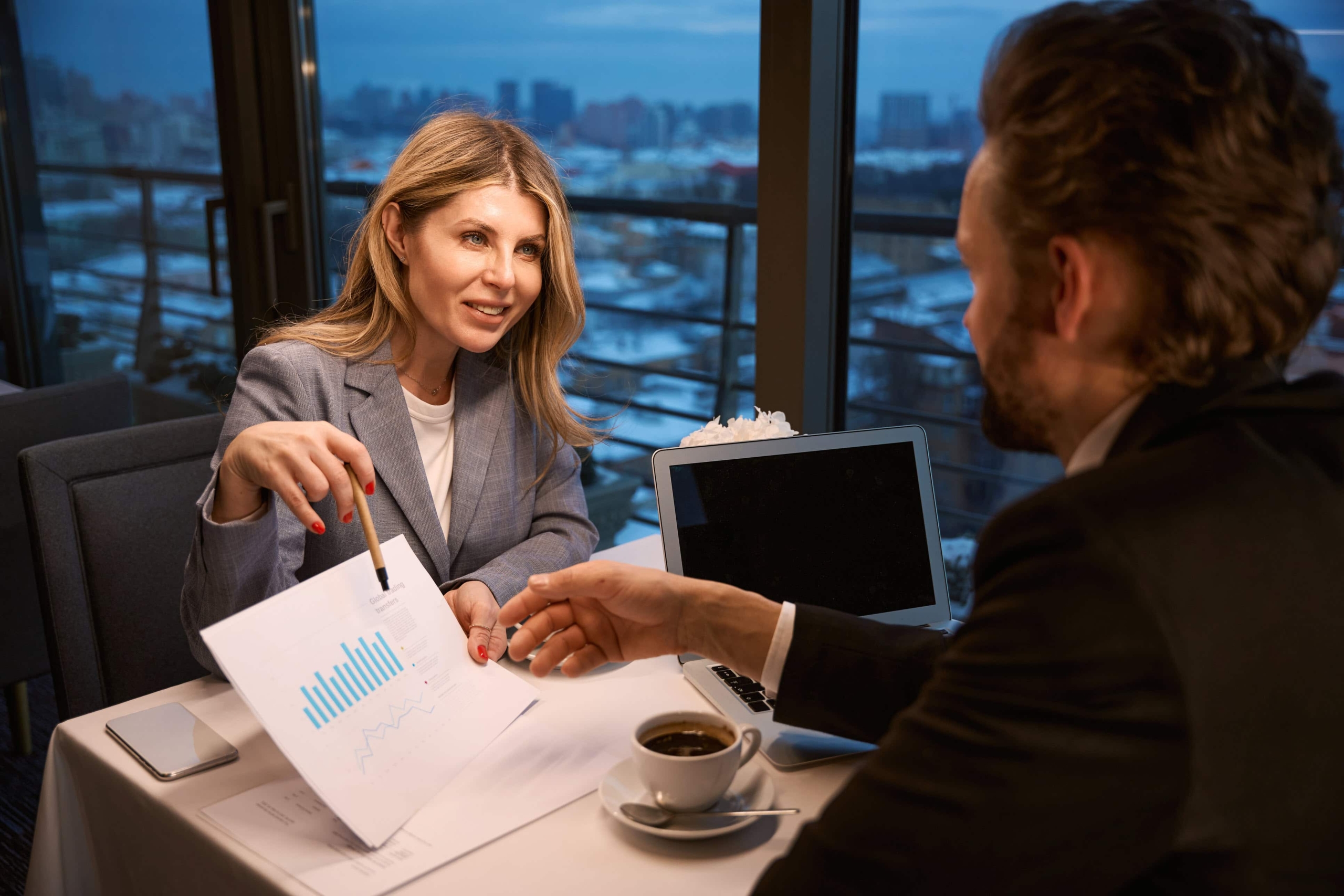 Woman w financial doc and city skyline