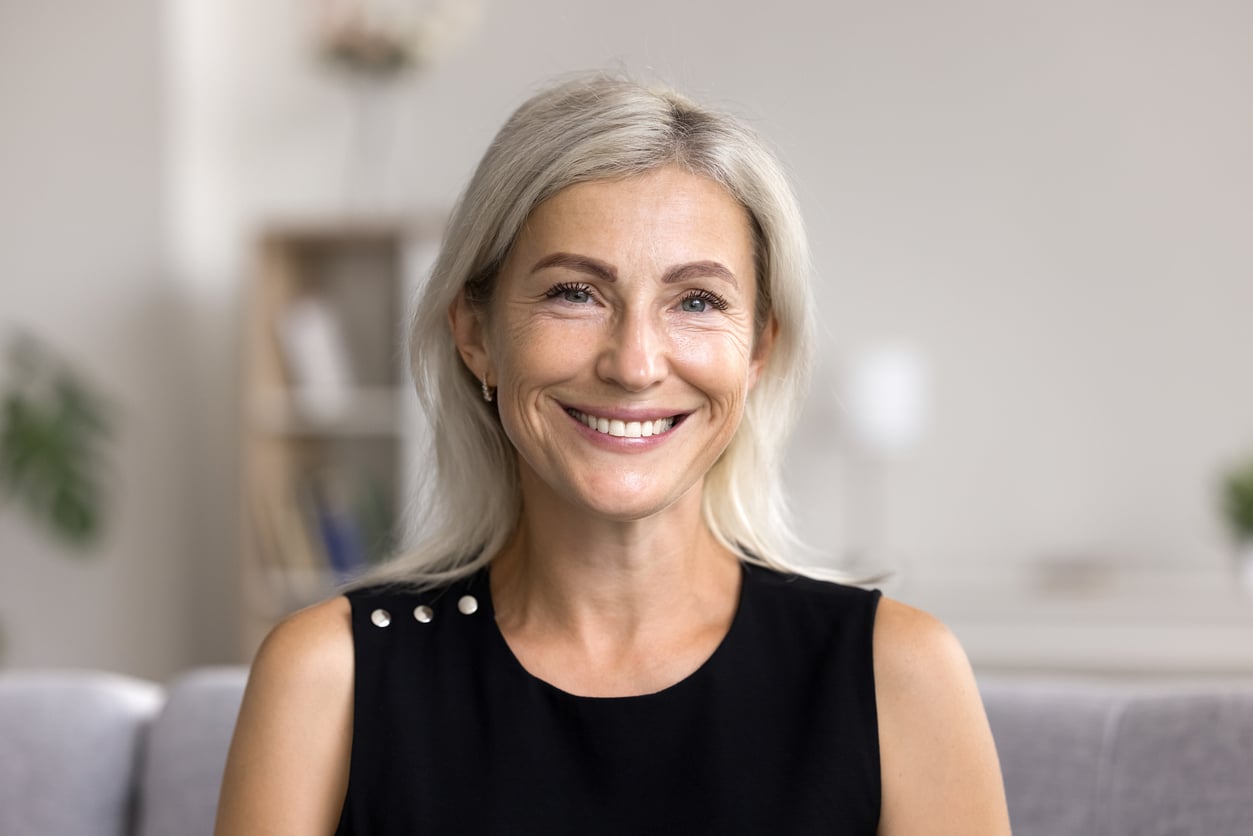 Adult daughter smiles at camera